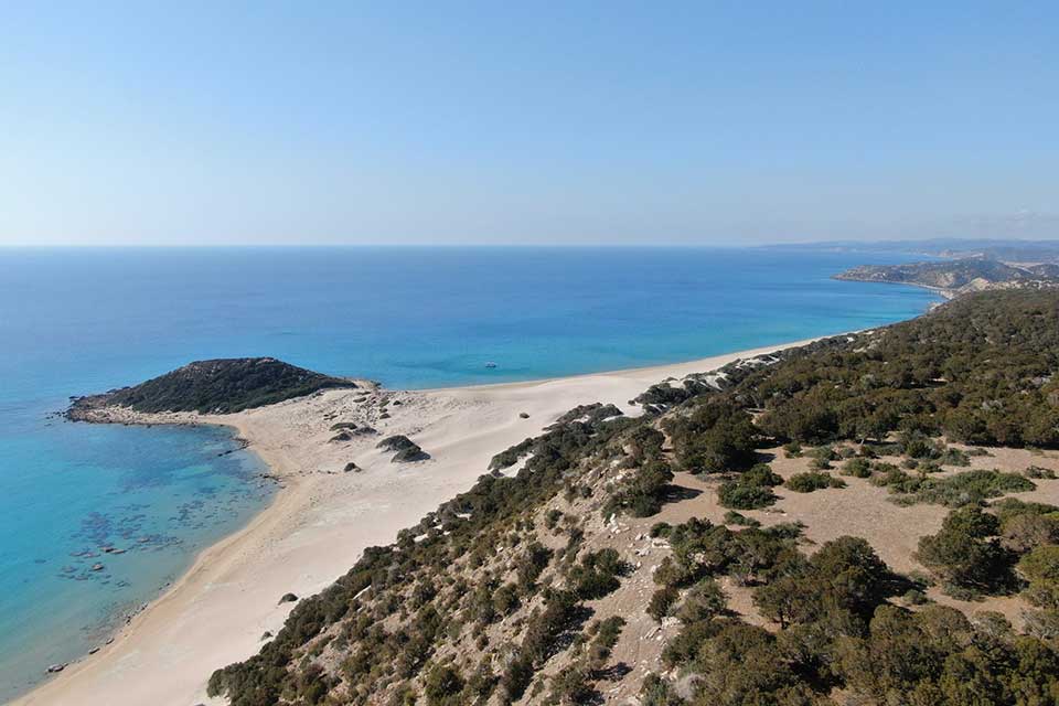 A photograph of a beach from an aerial view